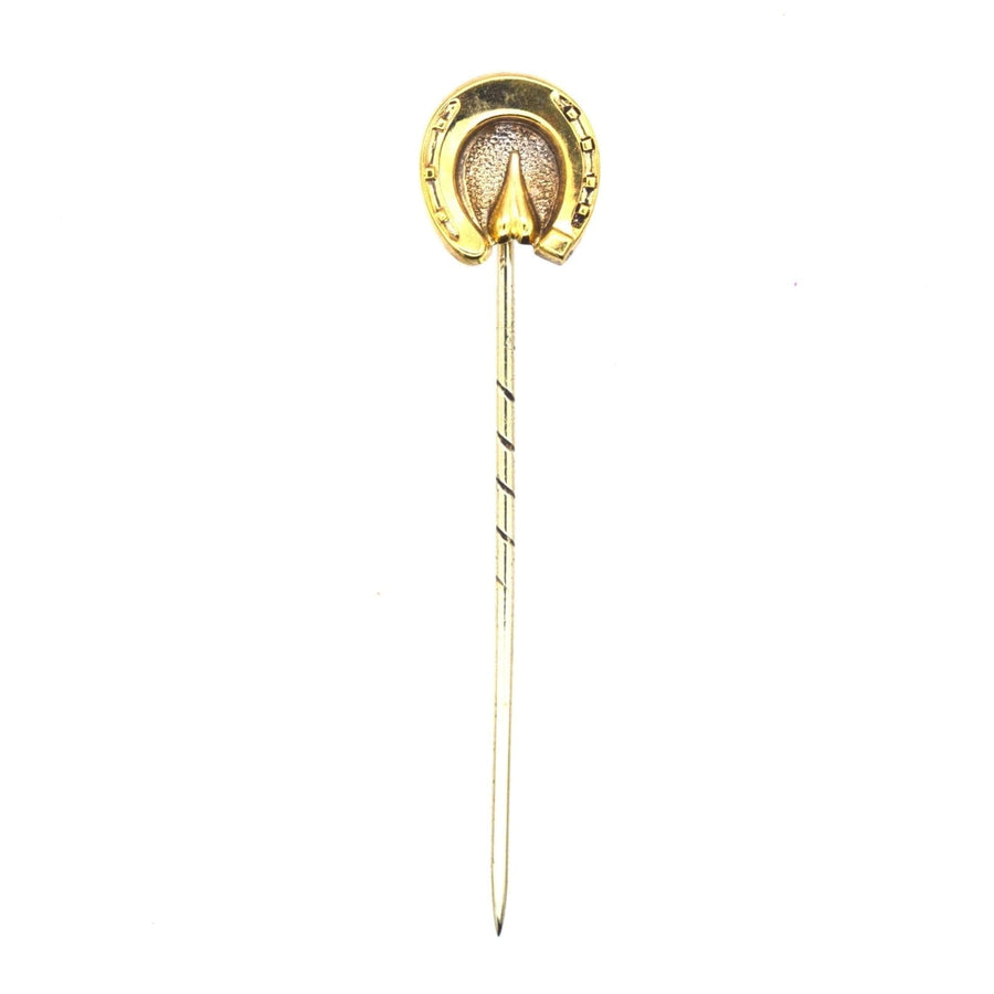 Victorian 9ct gold horseshoe tie pin symbolizing good luck and protection, perfect for enhancing silk ties.