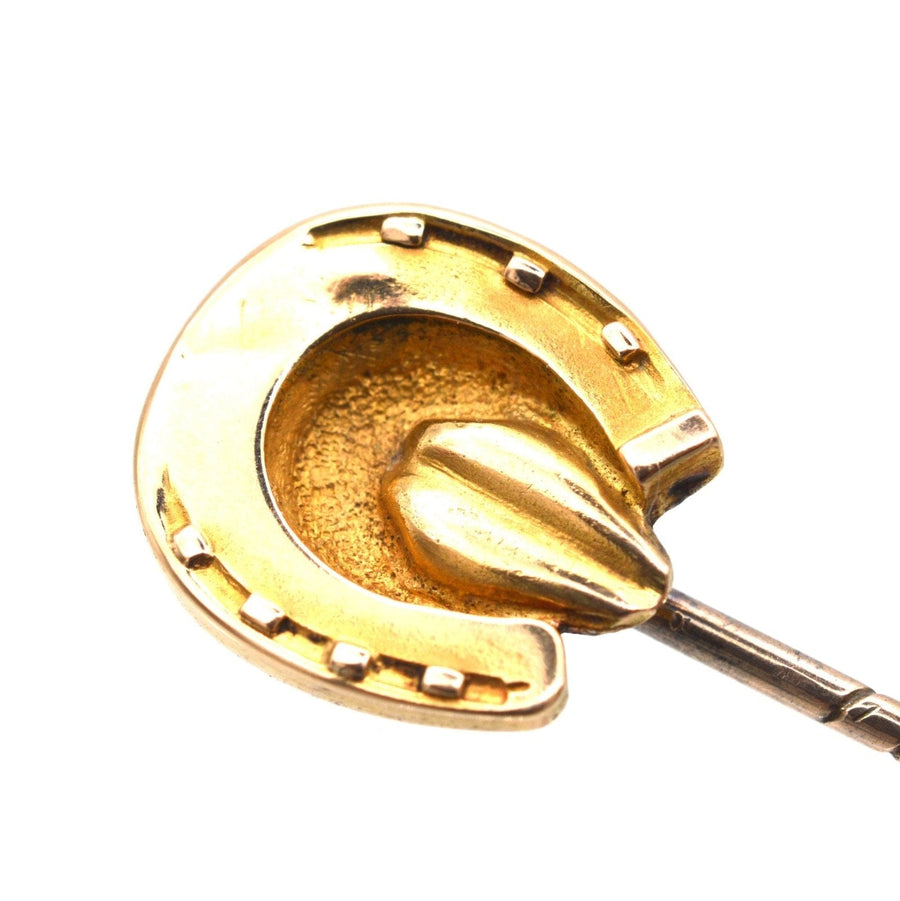 Victorian 9ct gold horseshoe tie pin symbolizing luck and protection from evil, featuring detailed design.