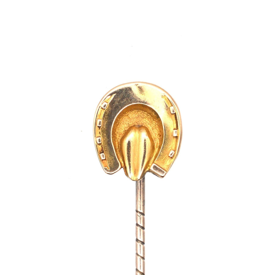 Victorian 9ct gold horseshoe tie pin symbolizing luck and protection, featuring a detailed design.