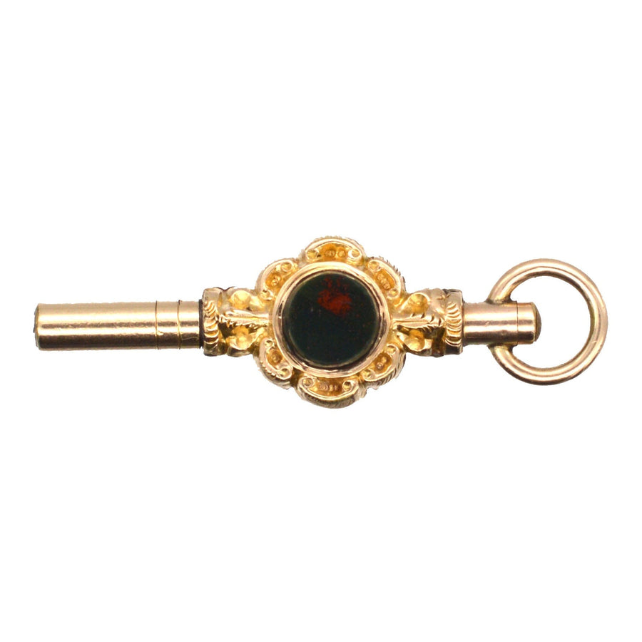 Victorian gold cased watch key featuring bloodstone and cornelian, circa 1830-1850, elegant pendant design.