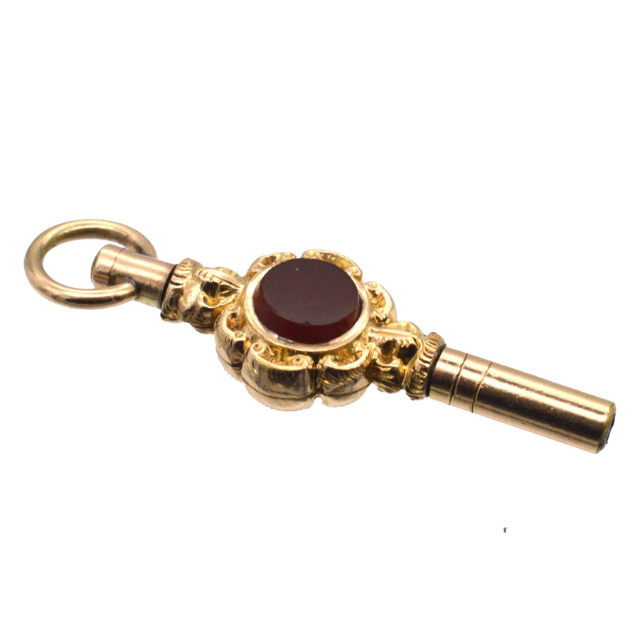 Victorian gold watch key featuring a bloodstone and cornelian, 1830-1850, elegant accessory.