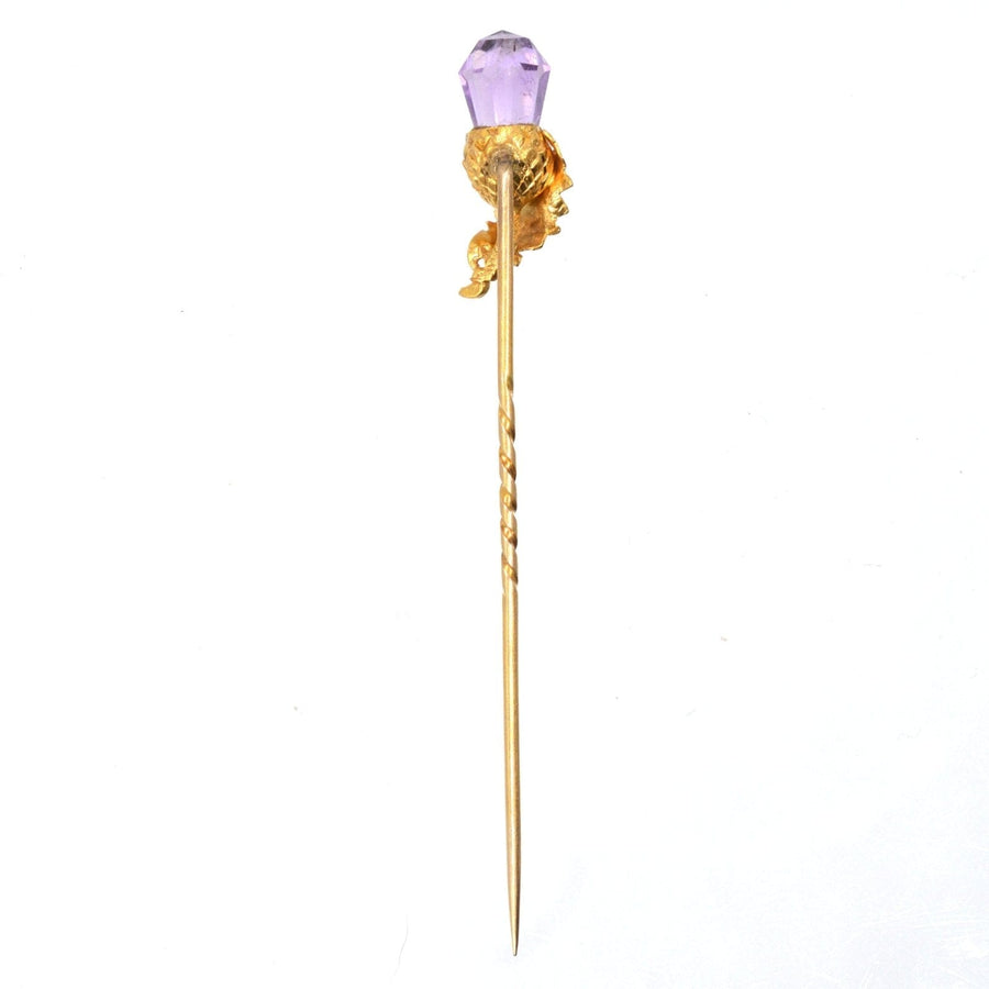 Victorian 18ct gold tie pin featuring a briolette cut amethyst and decorative acorn and leaf design.