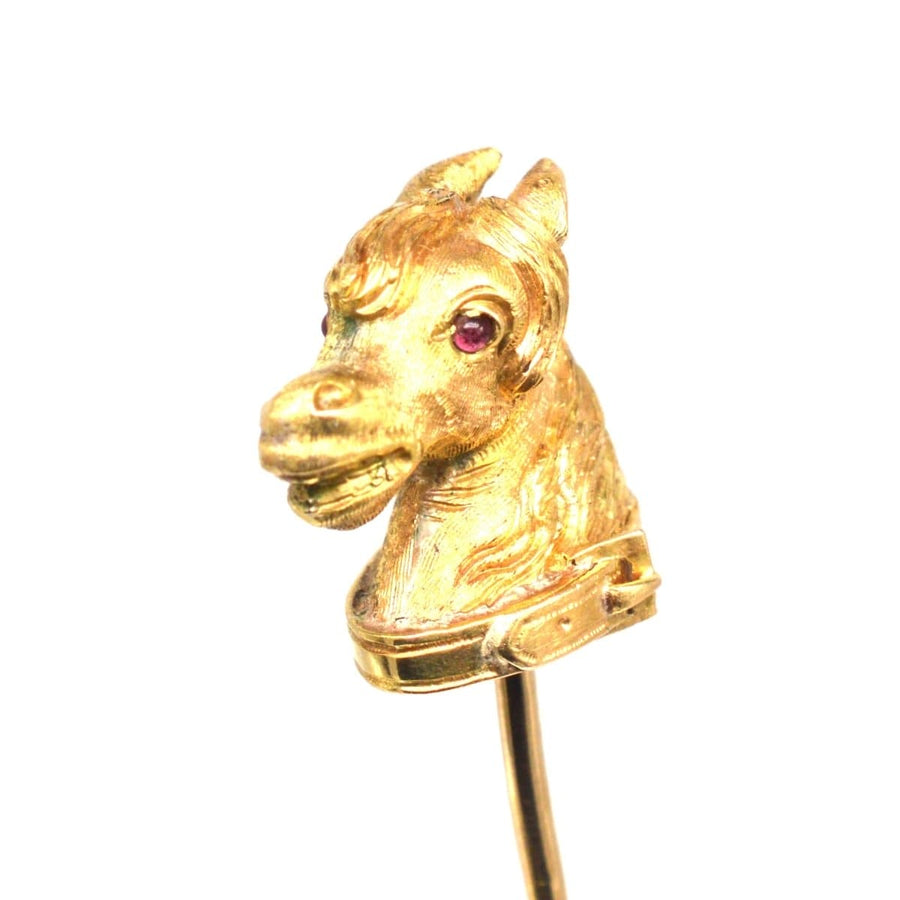 Victorian Scottish 18ct gold horse head tie pin with ruby eyes and garter belt design.