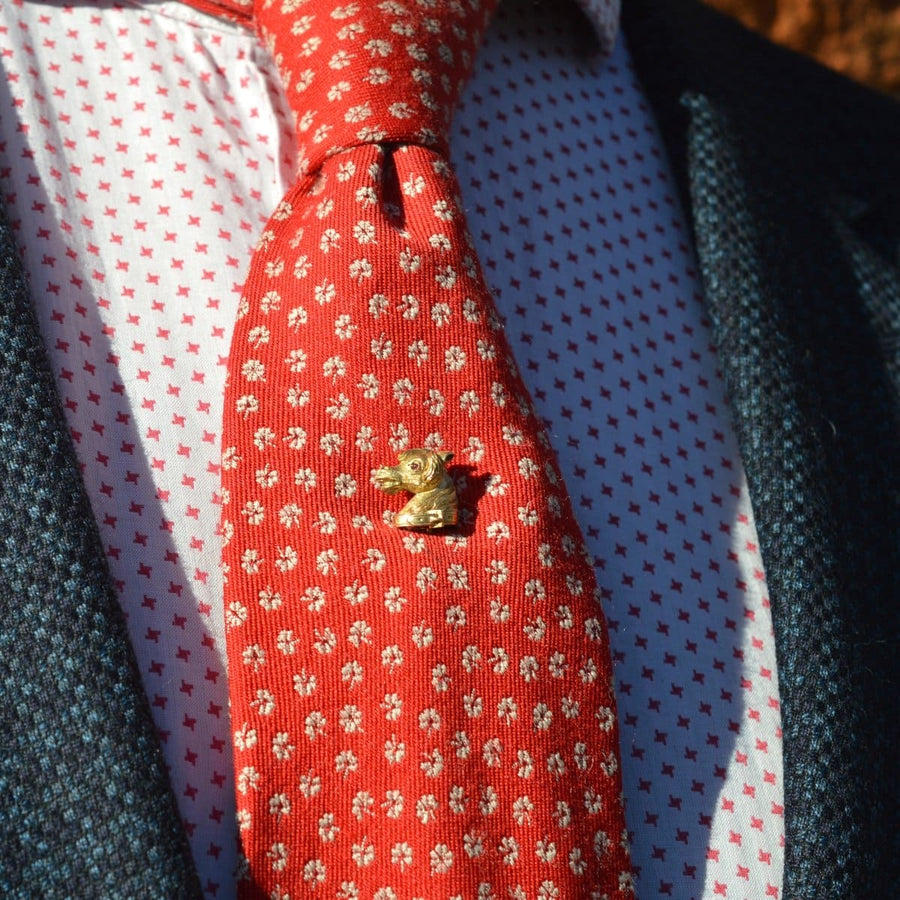 Victorian Scottish 18ct gold horse head tie pin on colorful silk tie, accentuating style and heritage.