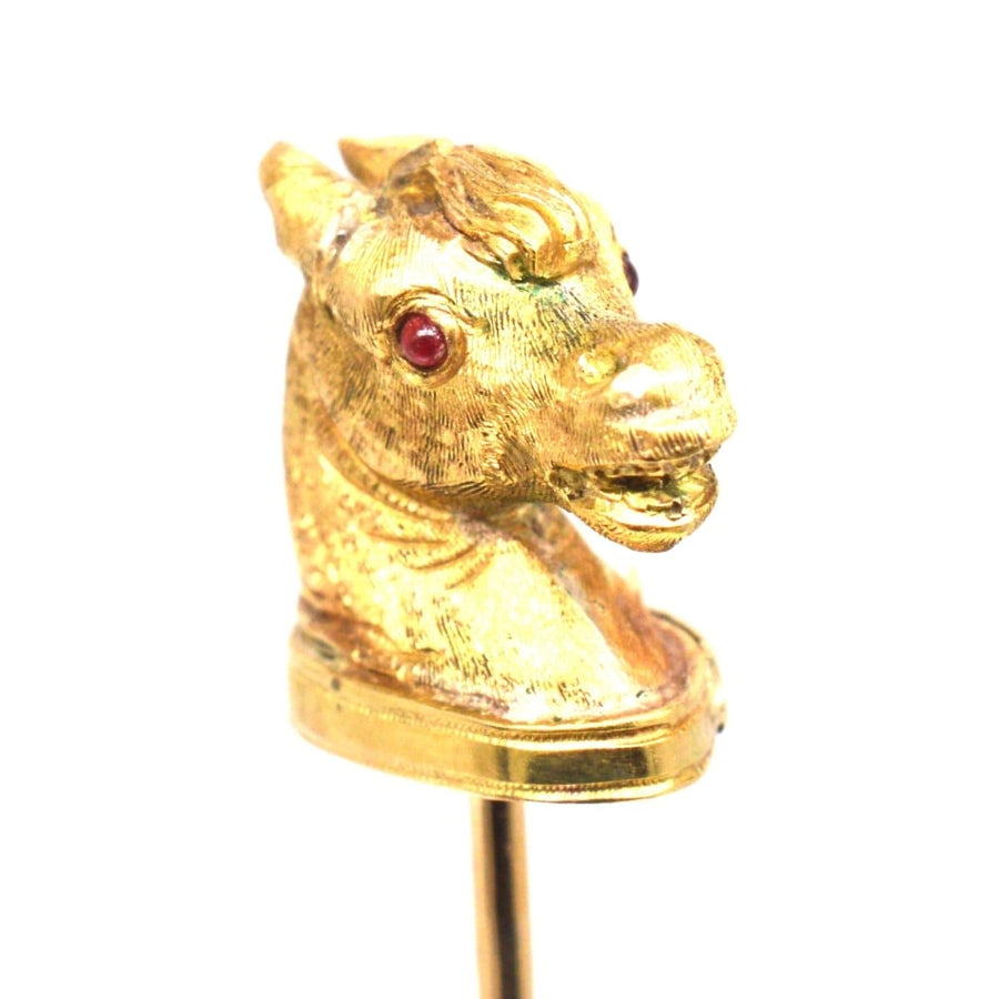 Victorian Scottish 18ct gold horse head tie pin with ruby eyes and garter belt detail.