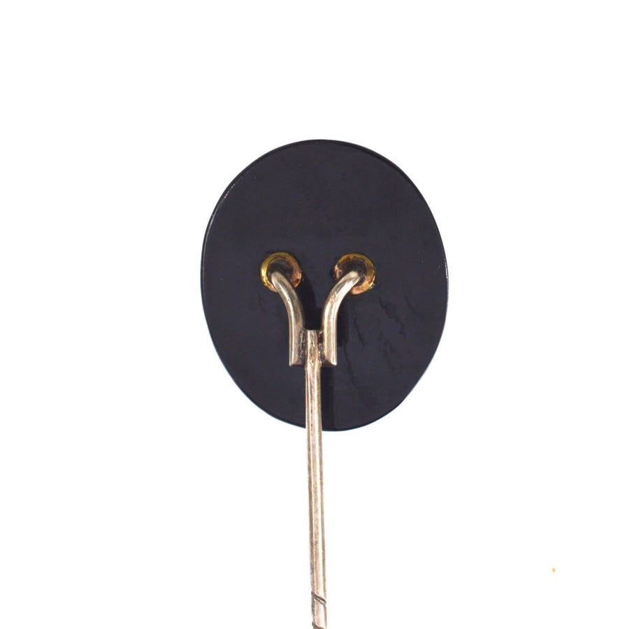 Victorian tie pin featuring Whitby Jet base and metal clasp, ideal for elegant dress wear.