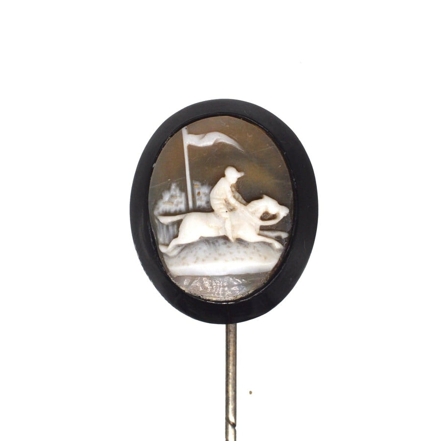 Victorian Shell Cameo tie pin featuring a horse and rider in action, set on Whitby Jet, dating from the 1860s-1880s.