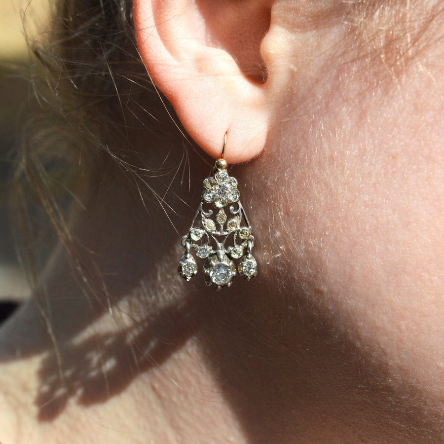 Victorian silver paste chandelier earrings, showcasing elegant design and vintage sparkle, worn by a model.