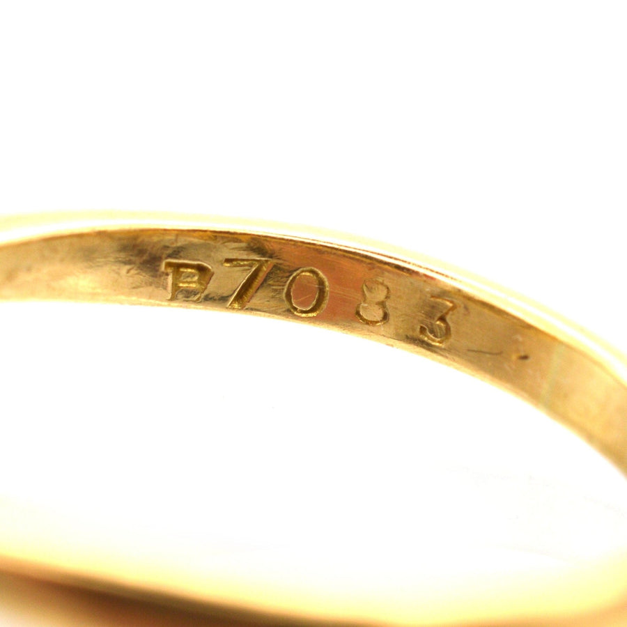 Inside view of a vintage 18ct gold and platinum diamond square ring showing P7083 engraving.