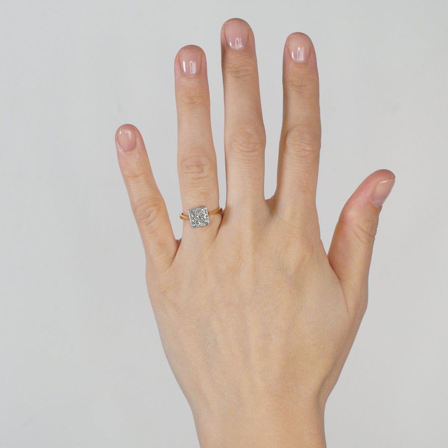 Vintage 18ct gold and platinum diamond square ring worn on hand, showcasing its unique design and elegance.