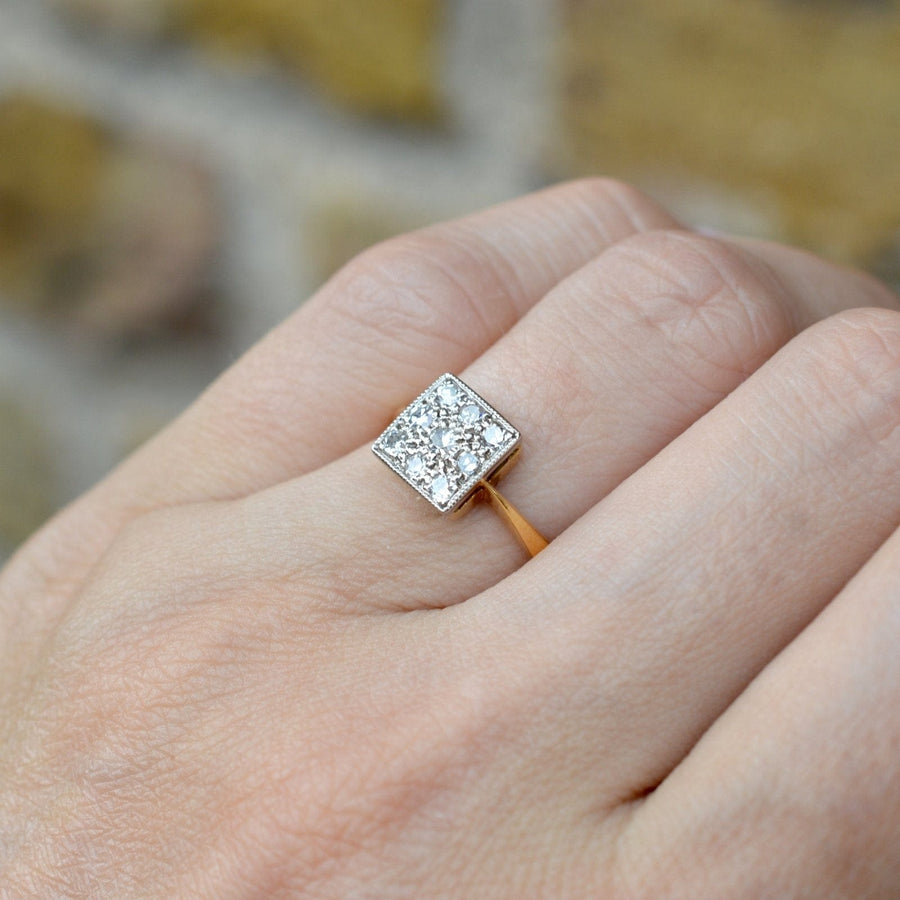 Vintage 18ct gold and platinum diamond square ring on hand, showcasing its unique diamond design and elegance.