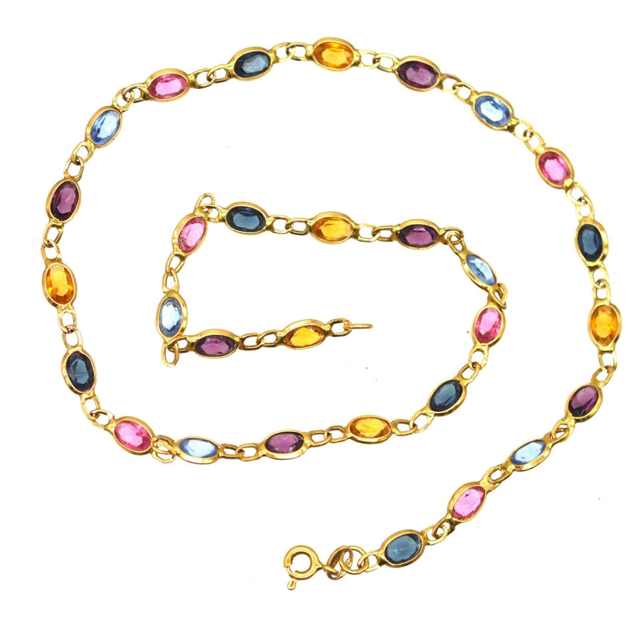 Vintage 18ct gold multi-stone necklace featuring colorful paste stones including blue, pink, and yellow.