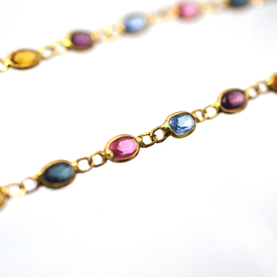Vintage 18ct gold multi-stone paste chain necklace featuring colorful gems on a delicate chain.