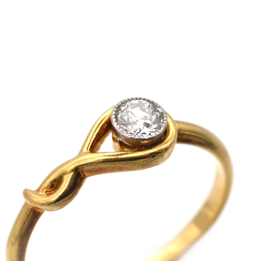Vintage 18ct gold ring with a bezel-set 0.20 carat diamond, designed as an elegant solitaire engagement ring.