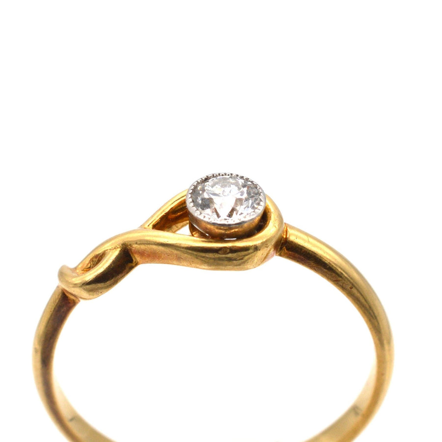 Vintage 18ct gold ring featuring a 0.20ct bezel-set diamond in a unique sinuous design.