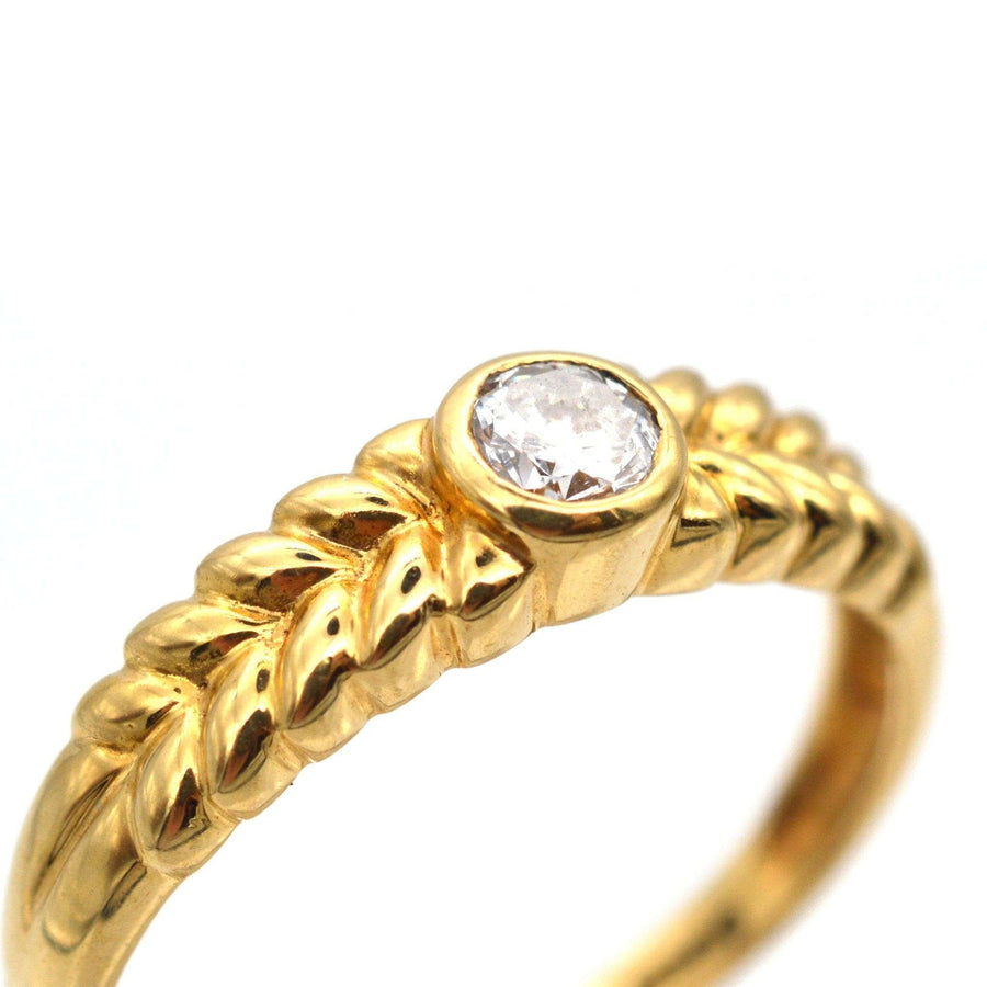 Vintage 18ct gold diamond solitaire ring with laurel wreath shoulders and 0.20 carat diamond, made in Birmingham.