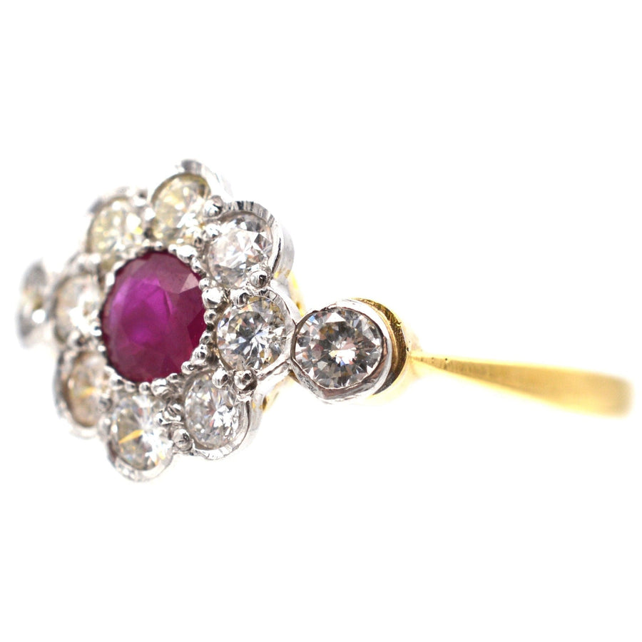 Vintage 18ct gold and platinum ruby and diamond cluster ring, featuring a natural ruby and diamond accents.