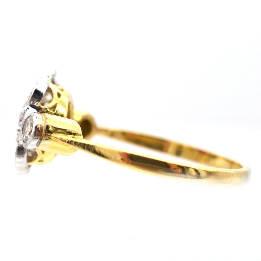 Vintage 18ct gold & platinum ruby and diamond cluster ring showcasing elegant side profile from the 1960s-1980s.