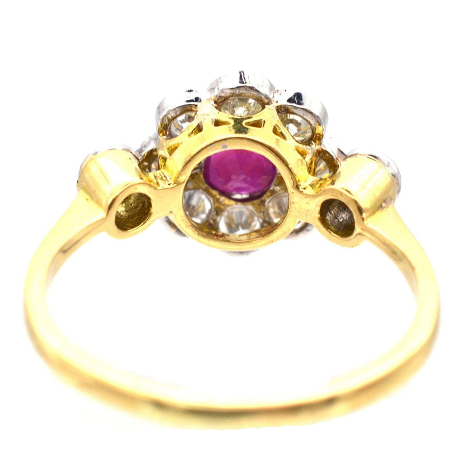 Vintage 18ct gold and platinum ruby diamond cluster ring, featuring a natural ruby and white diamonds, 1960s-1980s.