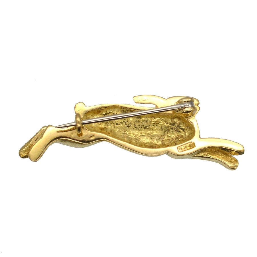 Vintage 18ct gold brooch of a playful rabbit with a diamond eye, perfect for lapels or ties.