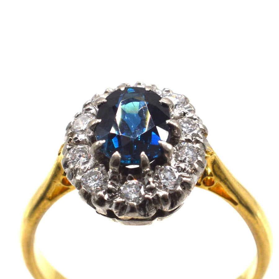 Vintage 18ct gold sapphire and diamond oval cluster ring, perfect for engagement or elegant jewelry collection.