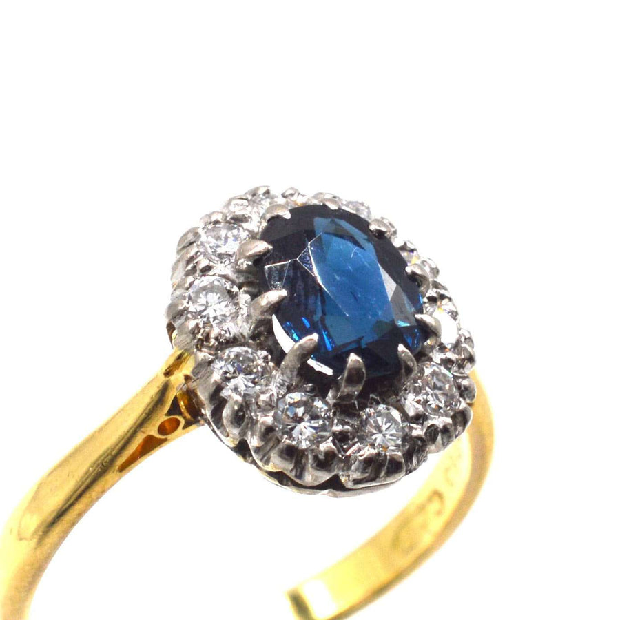 Vintage 18ct gold sapphire and diamond oval cluster ring, elegant design perfect for engagement.