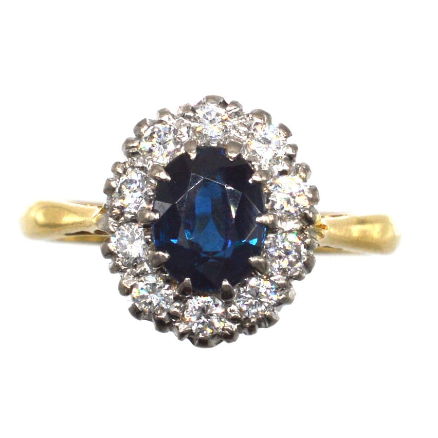 Vintage 18ct gold sapphire and diamond oval cluster ring with elegant design, perfect for engagement.