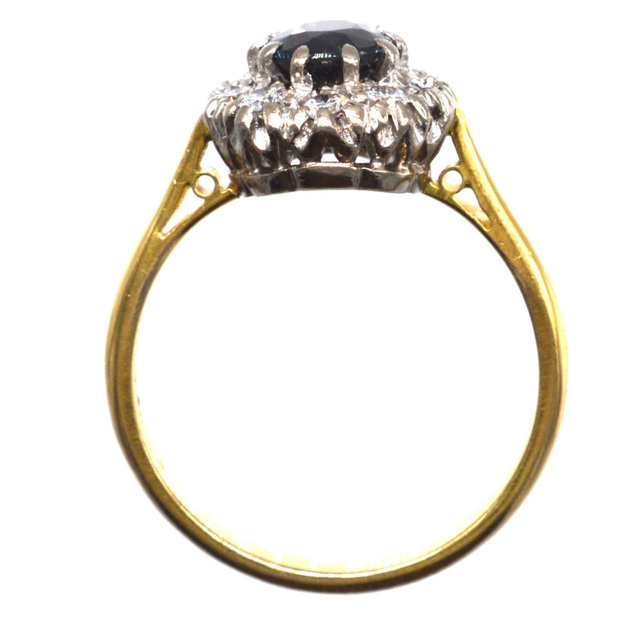 Vintage 18ct gold sapphire and diamond oval cluster ring, elegant design for classic engagement.