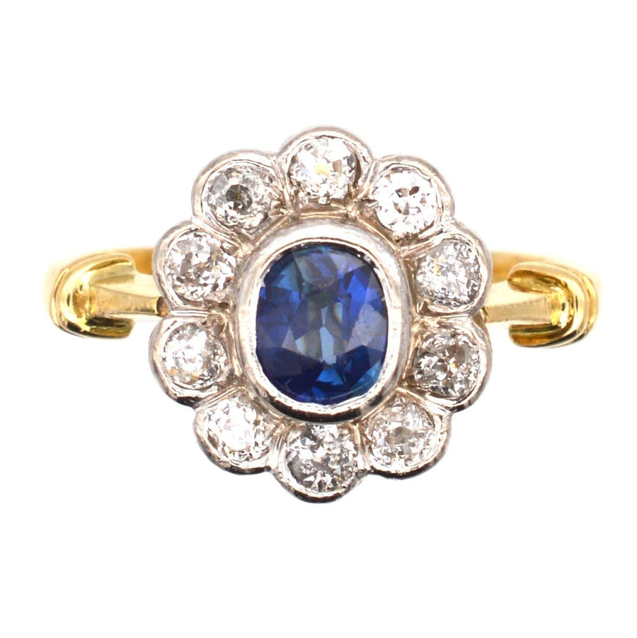 Vintage 18ct gold sapphire and diamond cluster ring with ten sparkling diamonds, perfect for an engagement.