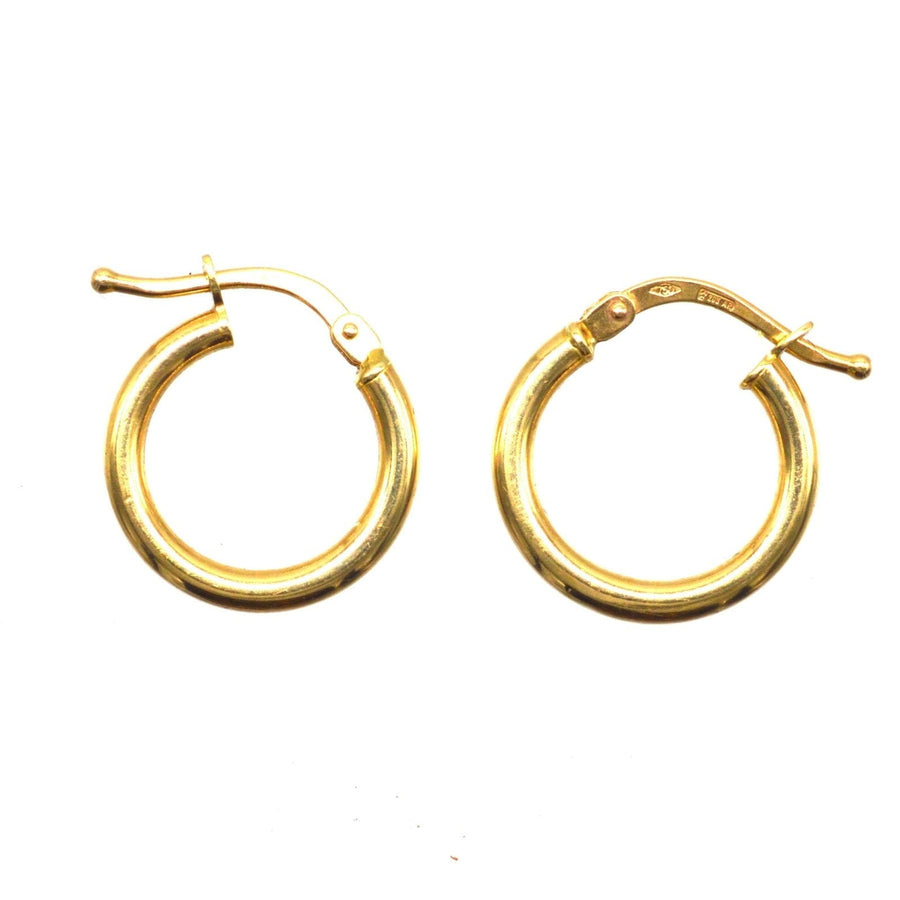 Vintage 18ct gold simple hoop 'huggie' earrings, versatile for formal and informal occasions.