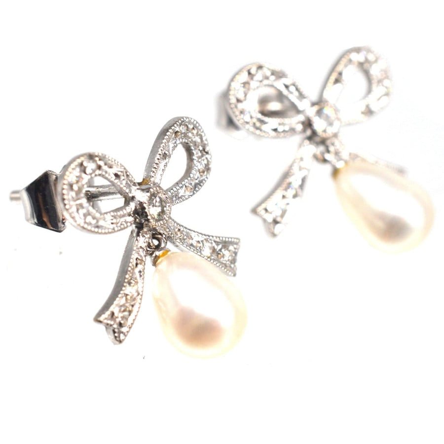 Vintage 18ct white gold diamond bow earrings with cultured pearl drops, perfect for brides or special occasions.
