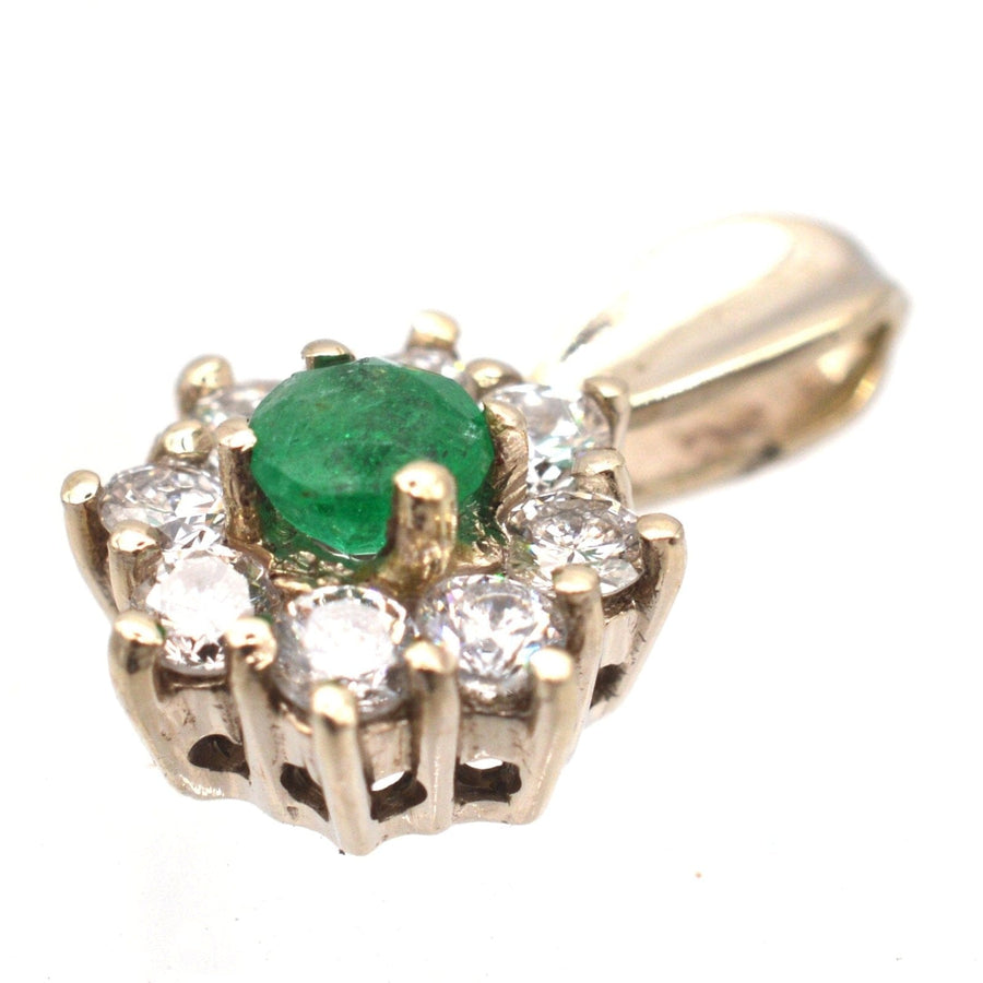 Vintage 18ct white gold emerald and diamond cluster pendant with bright diamonds and vibrant emerald.