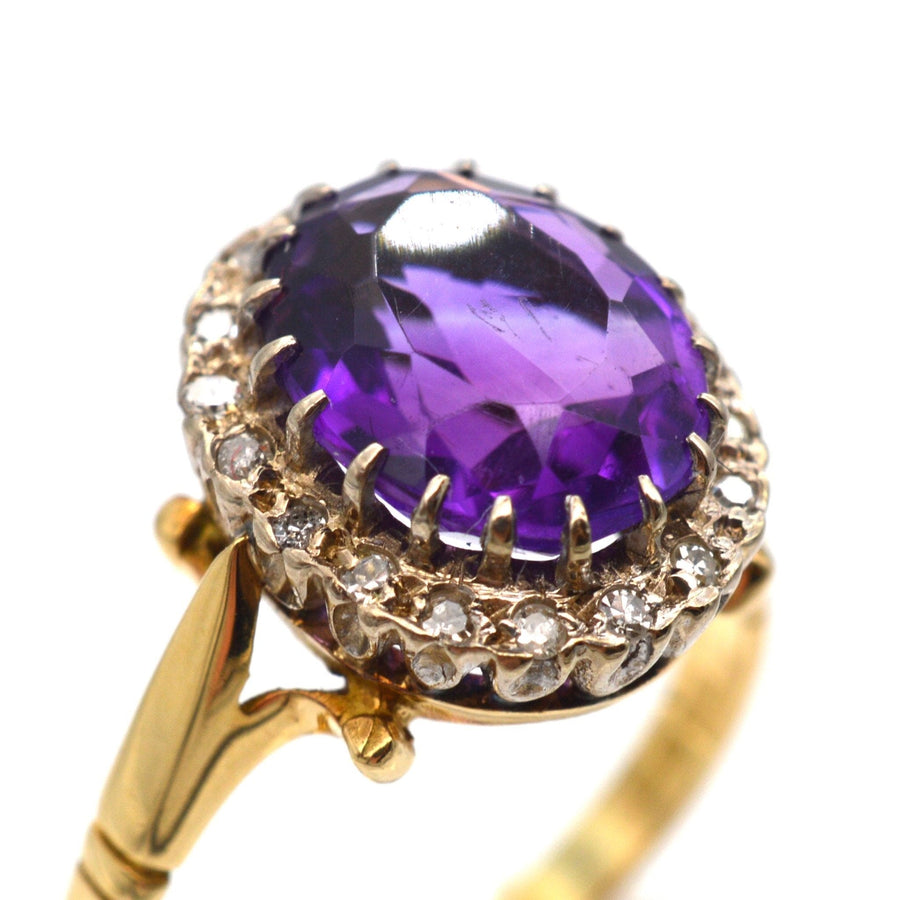 Vintage 1970s 18ct gold amethyst and diamond cluster ring with royal purple gemstone.