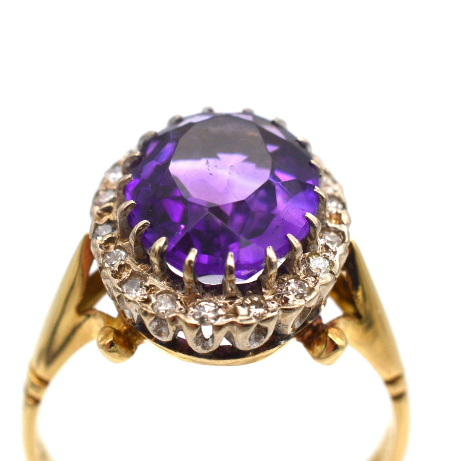 Vintage 1970s 18ct gold ring featuring a large royal purple amethyst and diamond cluster design.