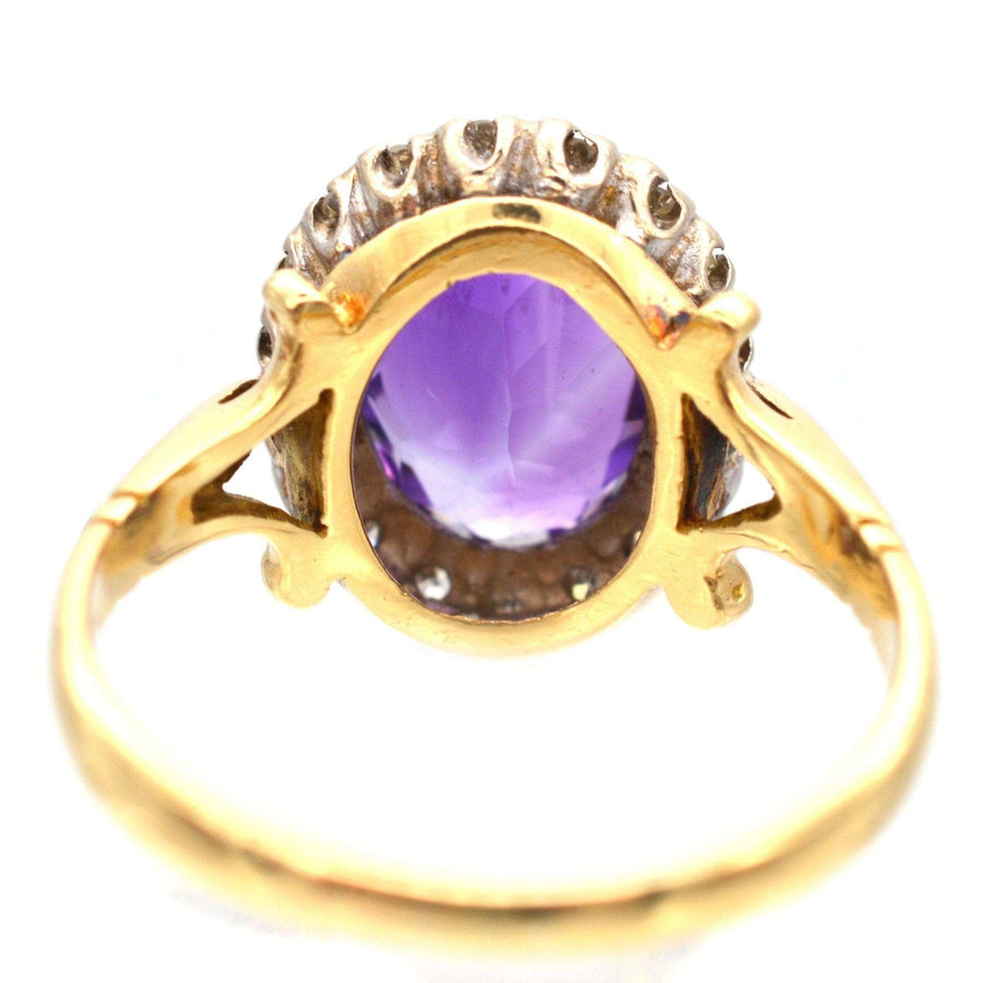 Vintage 1970s 18ct gold ring featuring a royal purple amethyst and diamond cluster design.