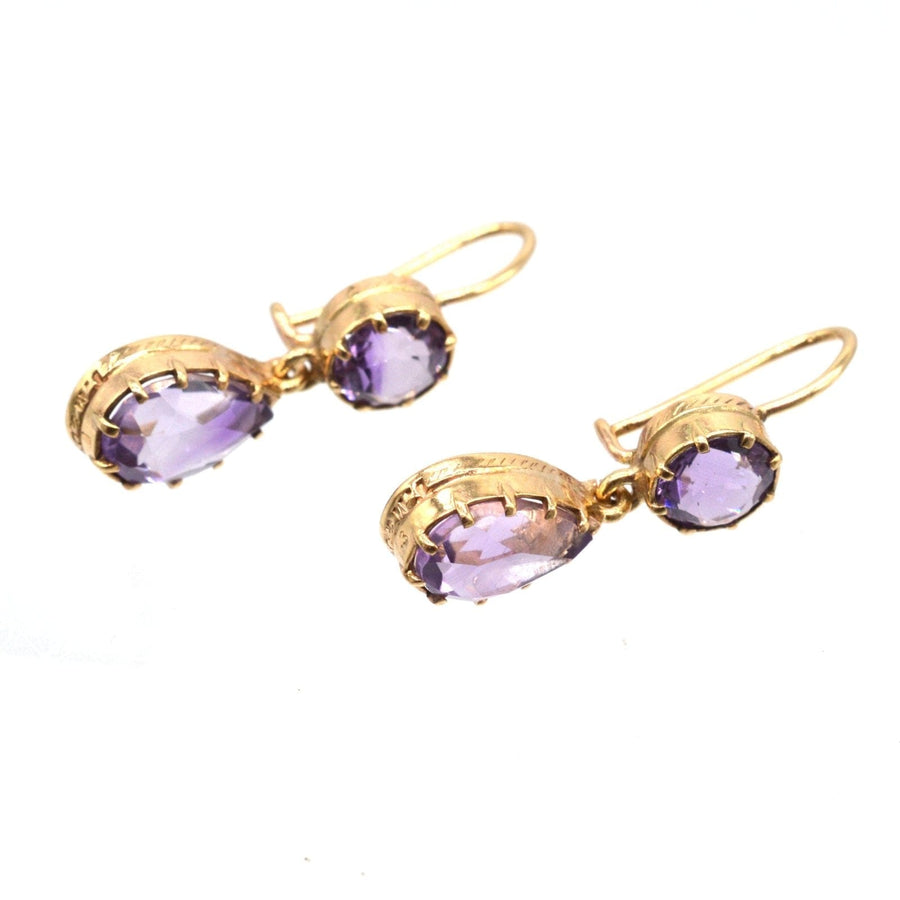 Vintage 9ct gold amethyst drop earrings featuring royal purple gemstones.