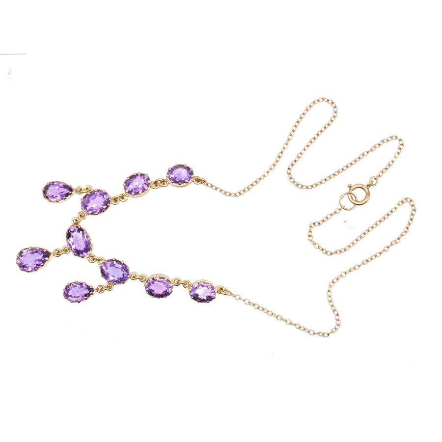 Vintage 9ct gold necklace with ten royal purple amethyst drops, featuring an elegant design.