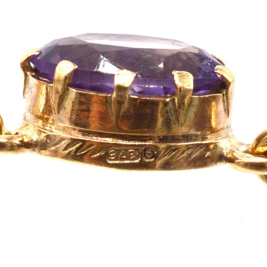 Close-up of vintage 9ct gold amethyst drop necklace showcasing a royal purple amethyst gemstone.