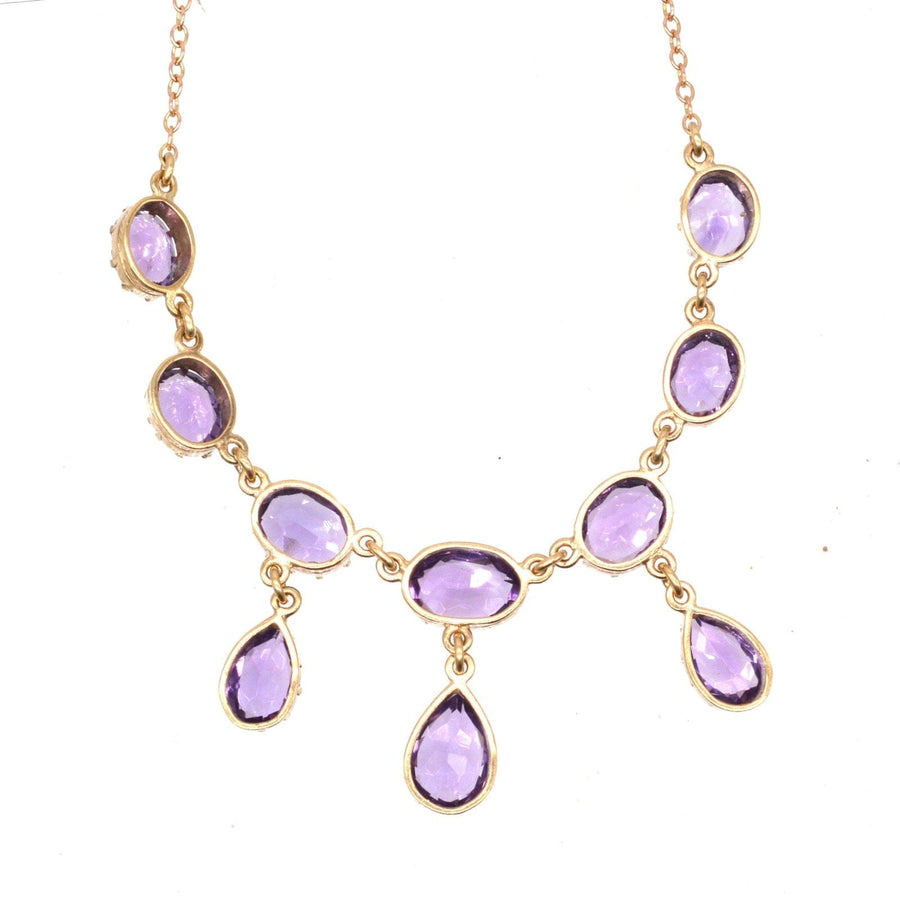 Vintage 9ct gold necklace with royal purple amethyst drops, elegantly designed for a dramatic look.