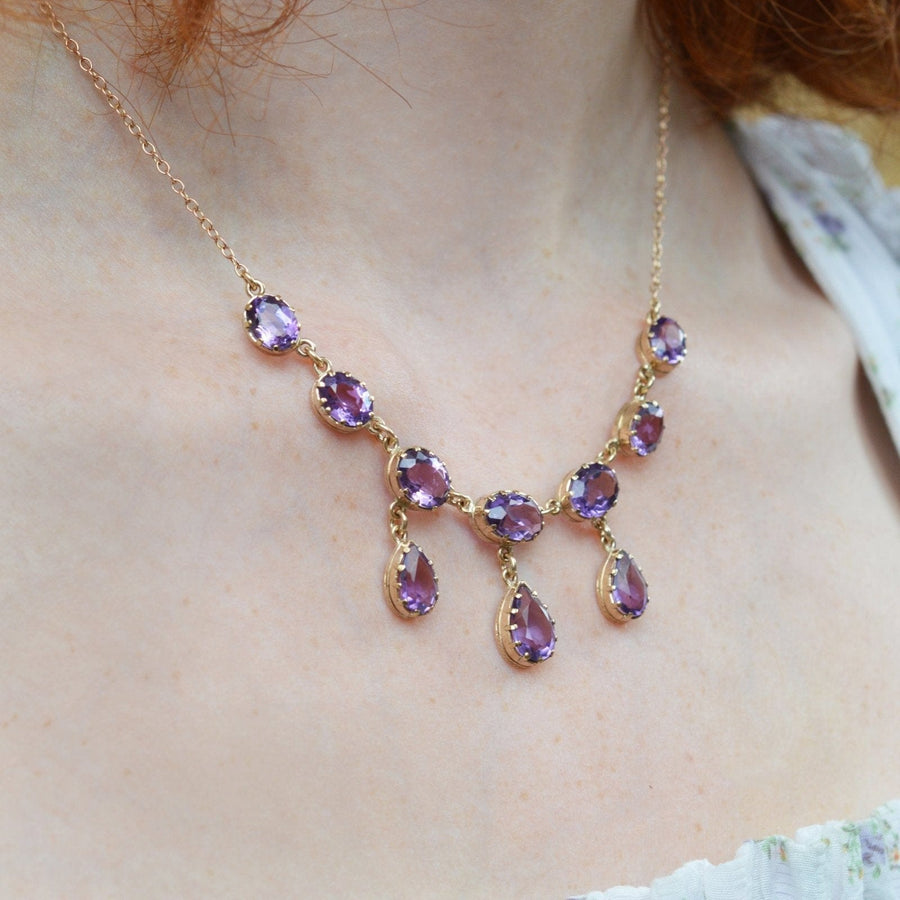Elegant vintage 9ct gold necklace with royal purple amethyst drops, perfect for a dramatic accessory.