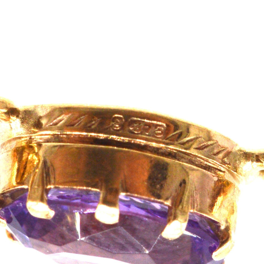 Close-up of vintage 9ct gold amethyst necklace showing detailed gemstone setting.