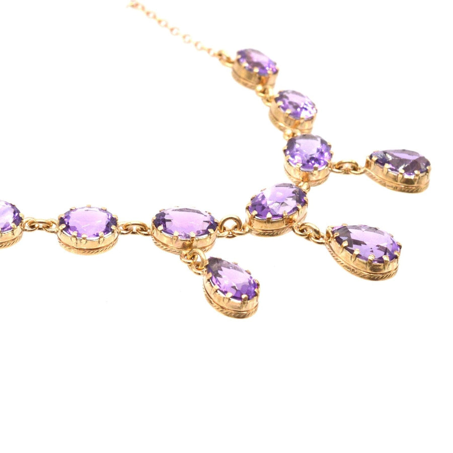 Vintage 9ct gold necklace with drop design featuring royal purple amethyst gemstones.