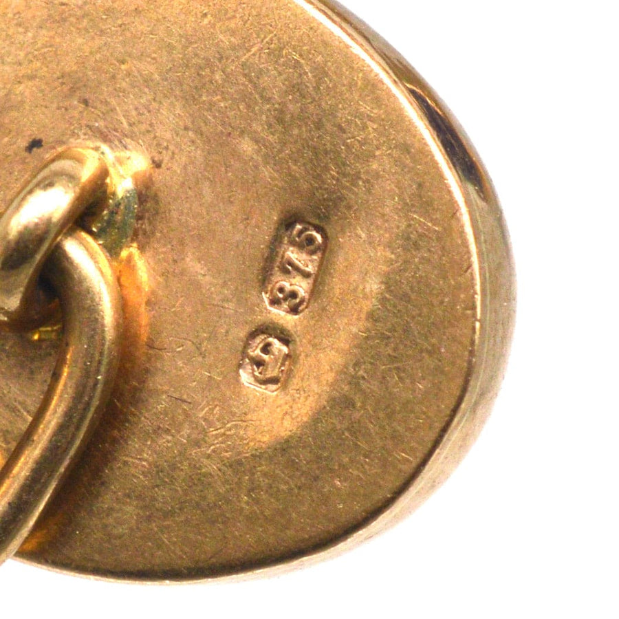 Hallmark detail of vintage 9ct gold amethyst cufflinks, showing assay mark 375.