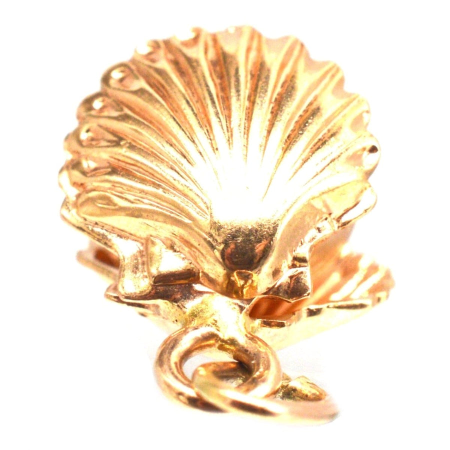 Vintage 9ct gold scallop shell charm pendant with Imitation Pearl, symbolizing hope and protection.