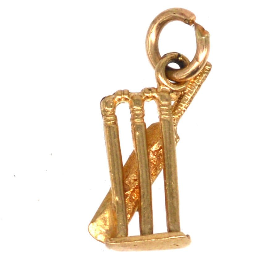Vintage 9ct gold charm pendant featuring a cricket bat, ball, and stumps, perfect for cricket fans.