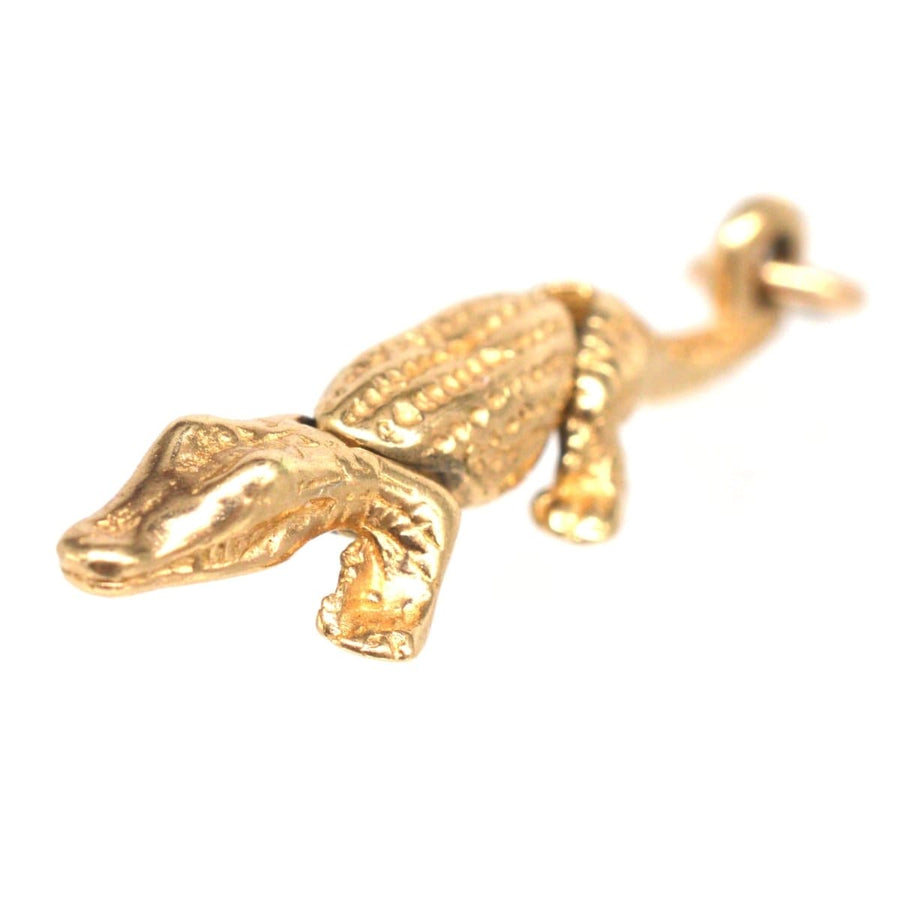 Vintage 9ct gold crocodile charm, articulated and detailed, perfect for charm bracelets or chains.