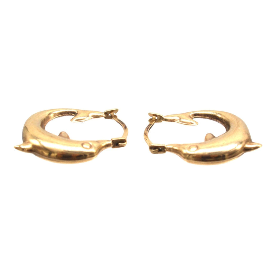 Vintage 9ct gold dolphin huggie hoop earrings, symbolizing harmony and grace, perfect for playful elegance.