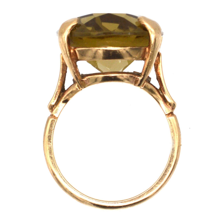 Vintage 9ct gold ring featuring a large smoky quartz gemstone, showcasing intricate design and 1970s elegance.