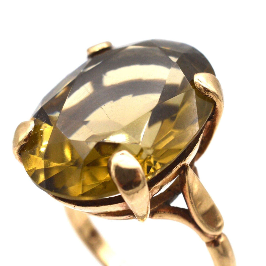 Vintage 9ct gold cocktail ring with large smoky quartz gemstone, showcasing a unique 1970s design.