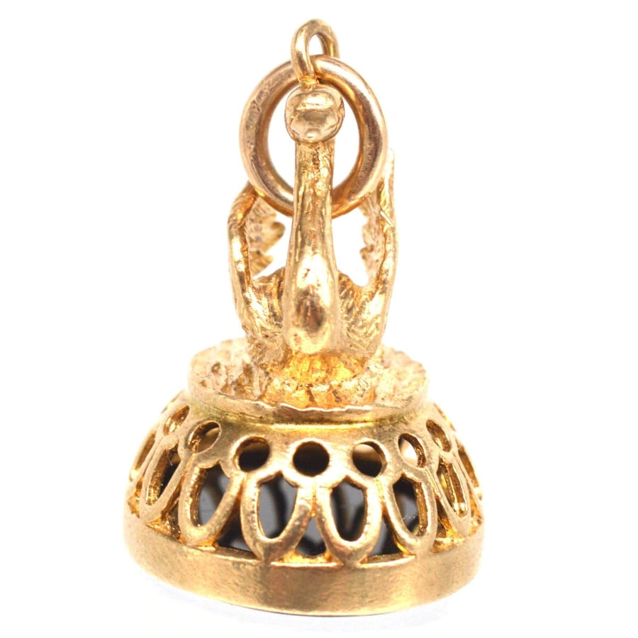 Vintage 9ct gold swan pendant with onyx seal of Hermes, showcasing intricate craftsmanship and elegant design.